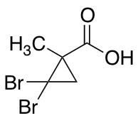 2,2-Dibromo-1-methylcyclopropanecarboxylic Acid