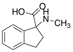 1-(Methylamino)-2,3-dihydro-1H-indene-1-carboxylic Acid