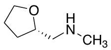 Methyl[(2S)-oxolan-2-ylmethyl]amine